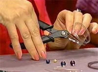 A woman cuts wire for the project